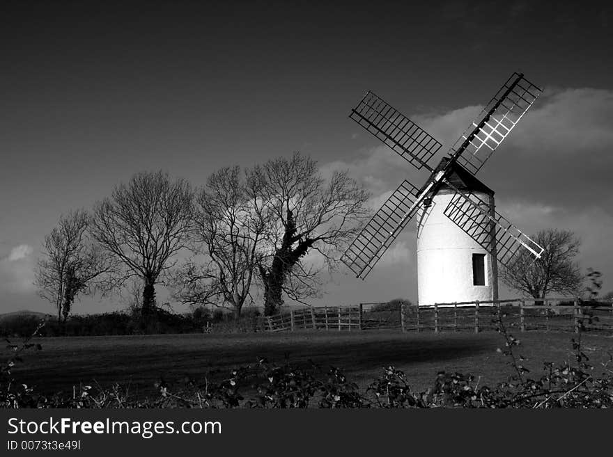 Black and white view of an old windmill. Black and white view of an old windmill