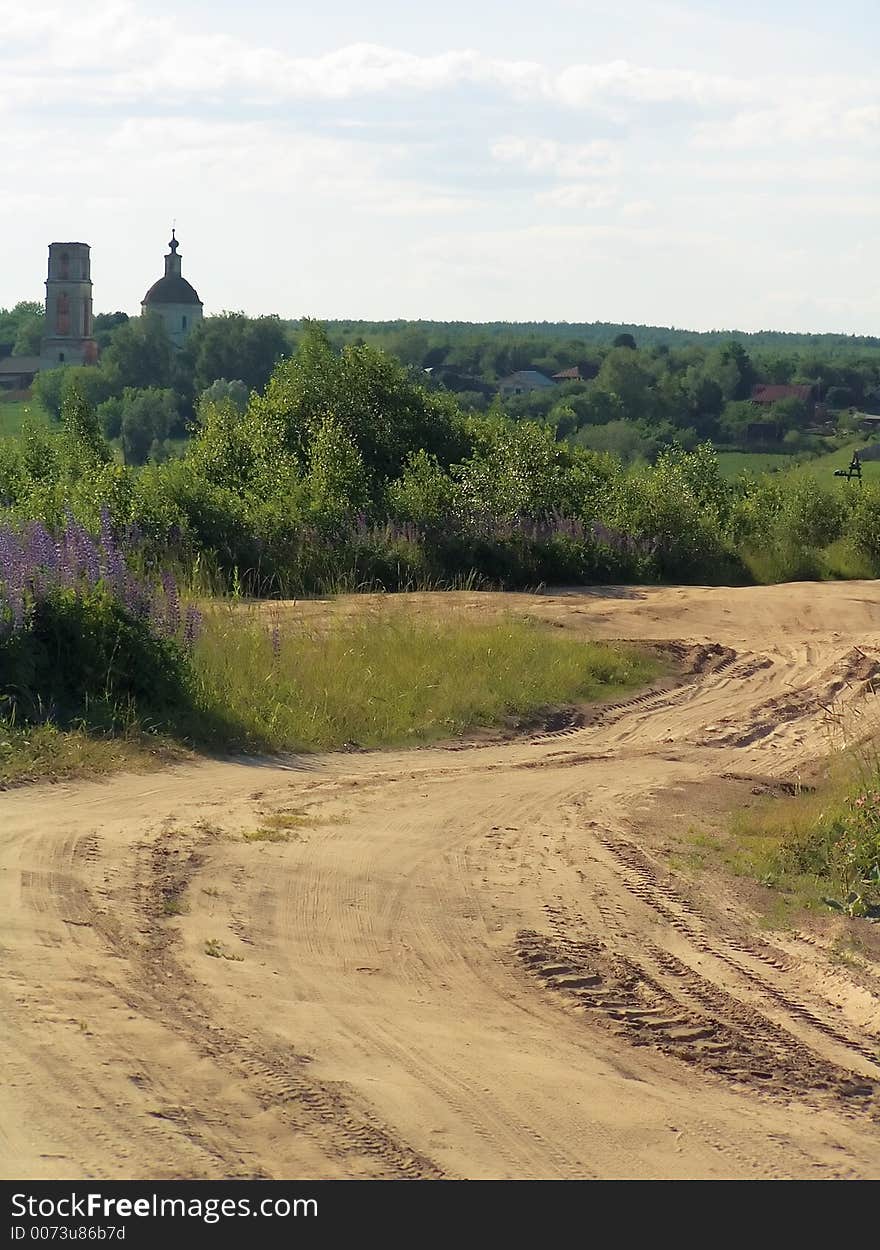 Road in village, aging church