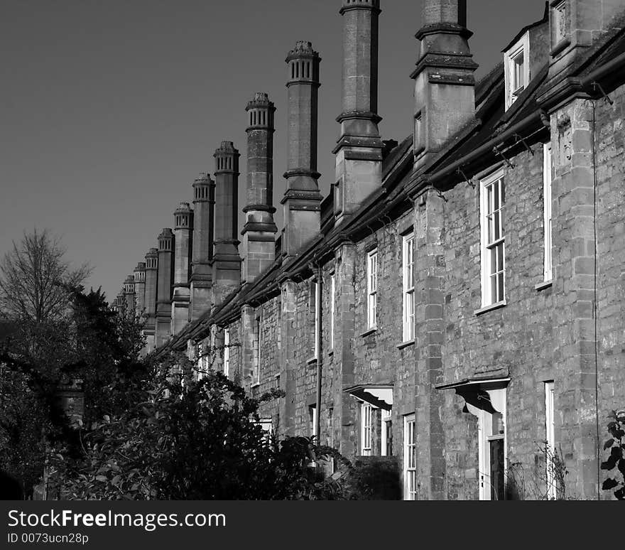 A cropped view of a row of mediaeval houses attached to Wells Cathedral in Wells, Somerset, England. A cropped view of a row of mediaeval houses attached to Wells Cathedral in Wells, Somerset, England