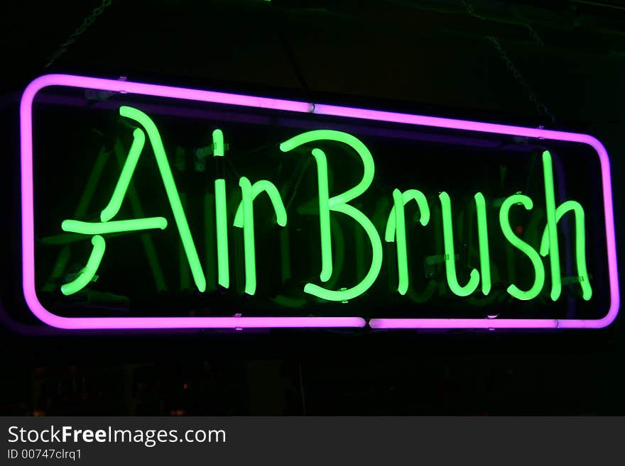 A neon sign with the words Air brush. A neon sign with the words Air brush