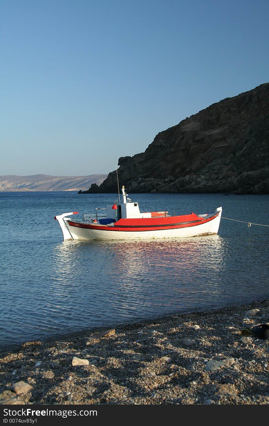 Boat waits ready to sail in the most idylic setting. Boat waits ready to sail in the most idylic setting