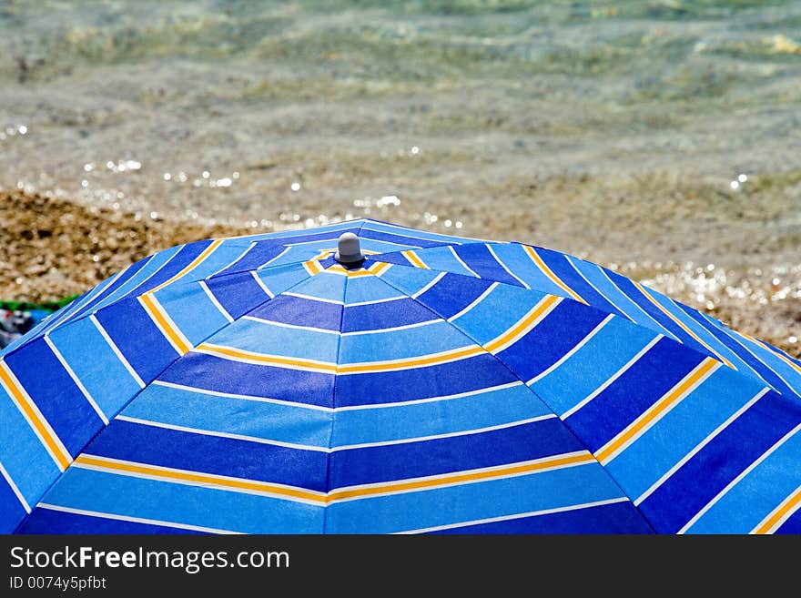 Summer umbrella and the sea