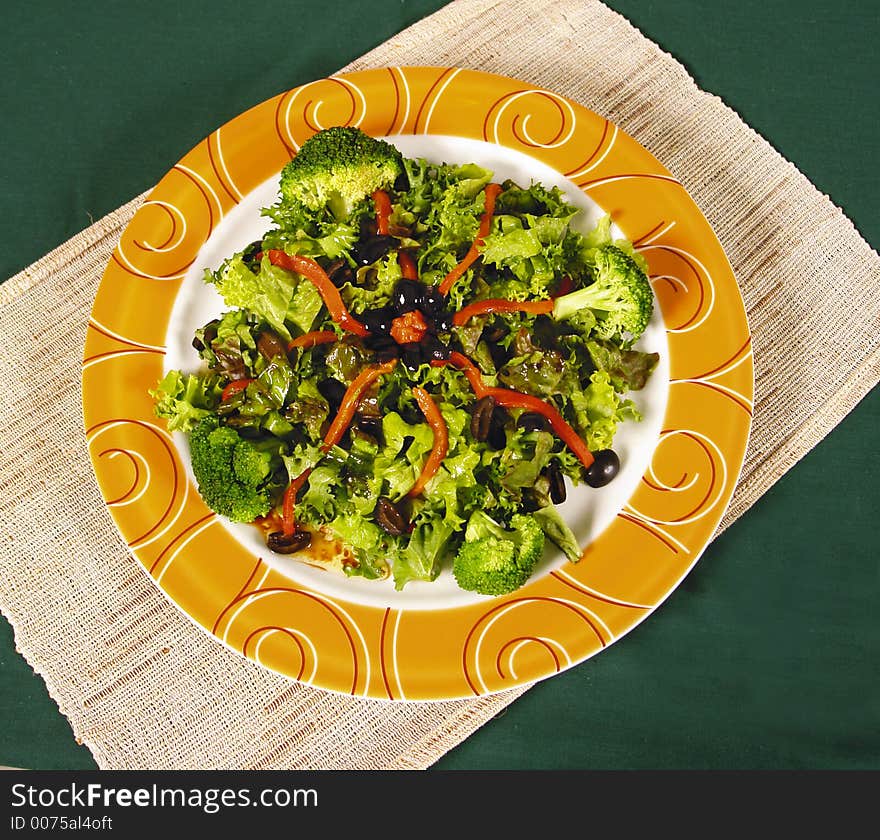 Fresh mixed salad with broccoli and black olives. Fresh mixed salad with broccoli and black olives