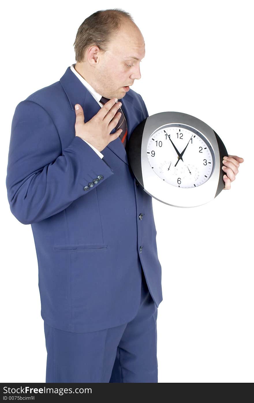 Businessman holding and looking at a clock. Businessman holding and looking at a clock