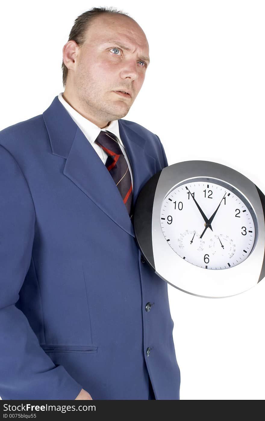 Businessman holding and looking at a clock. Businessman holding and looking at a clock