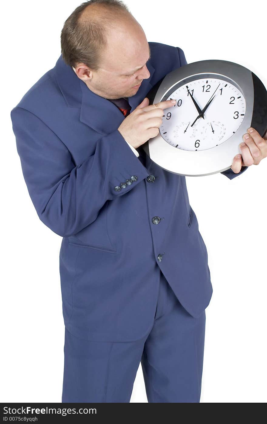 Businessman holding and looking at a clock. Businessman holding and looking at a clock