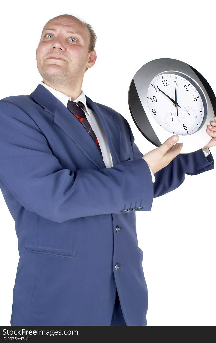 Businessman holding and looking at a clock. Businessman holding and looking at a clock