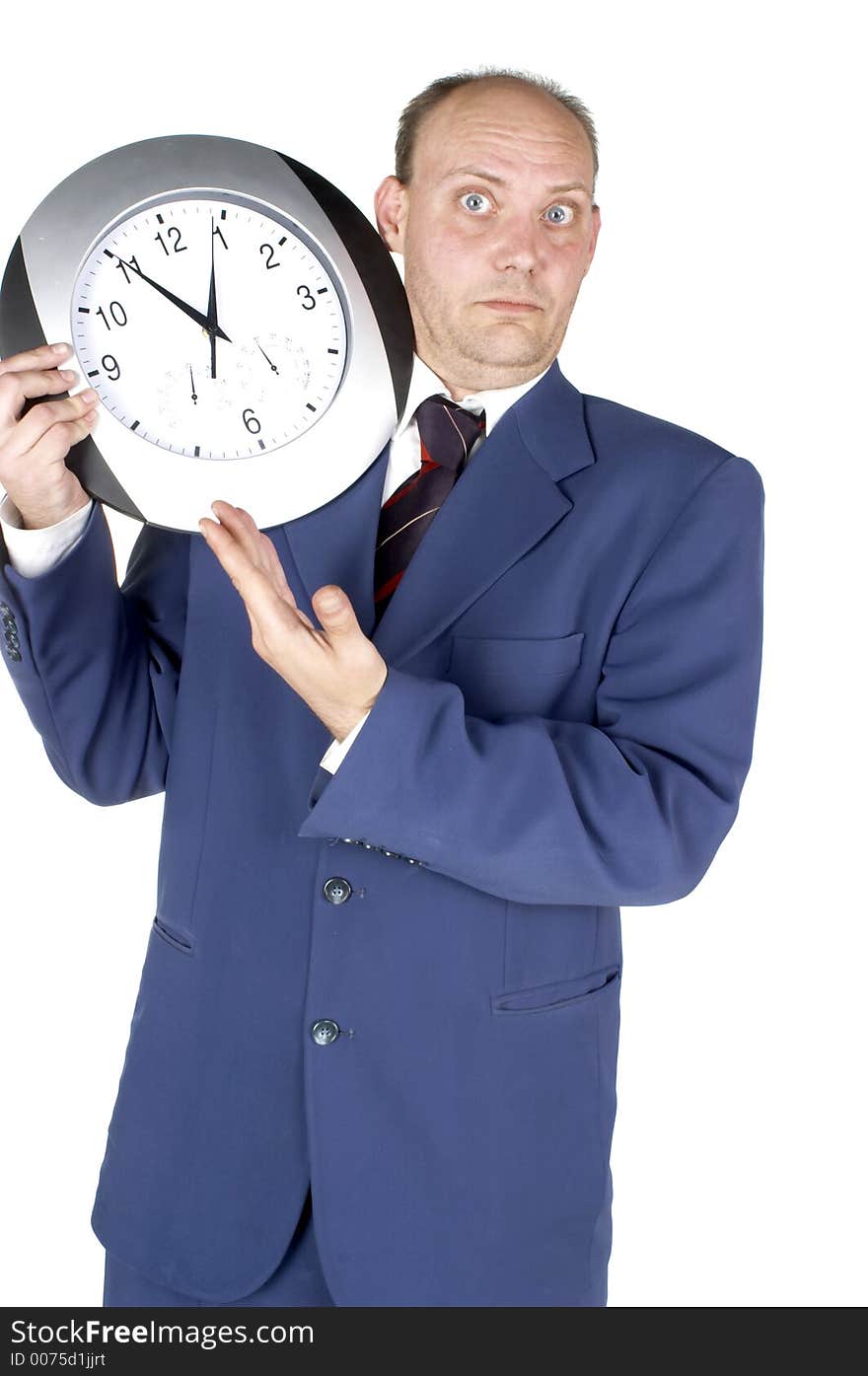 Businessman holding and looking at a clock. Businessman holding and looking at a clock