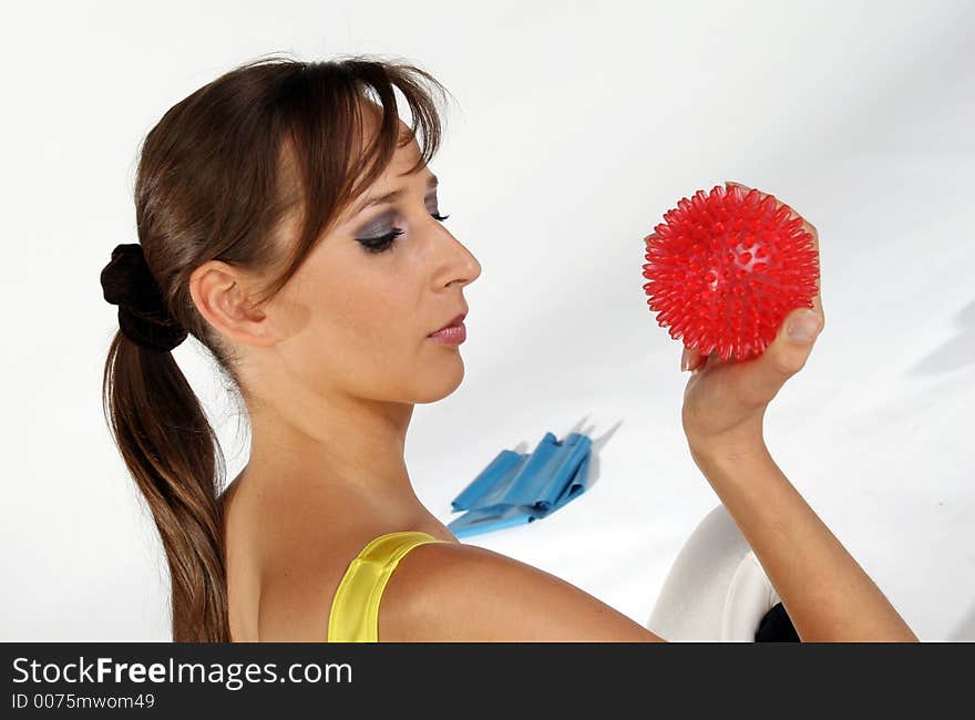 A Young model holding a spike ball. A Young model holding a spike ball