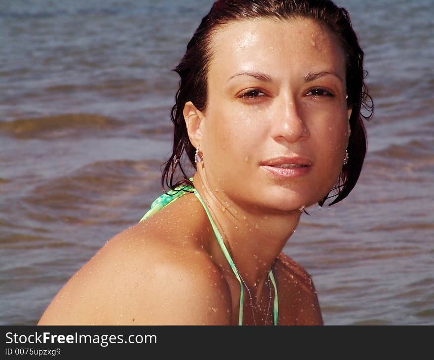 Young woman relaxing on the beach. Young woman relaxing on the beach