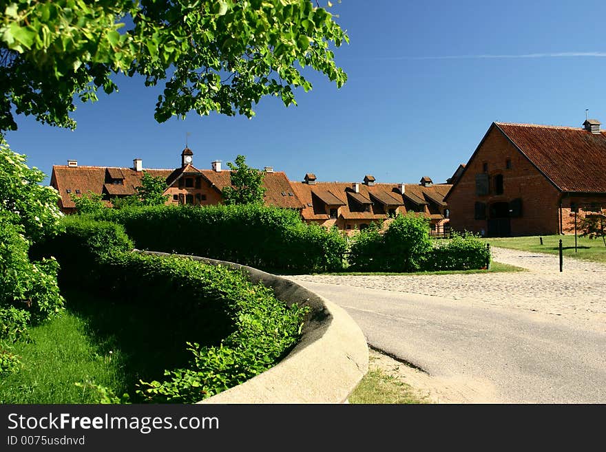 Road turning through a village in the countryside