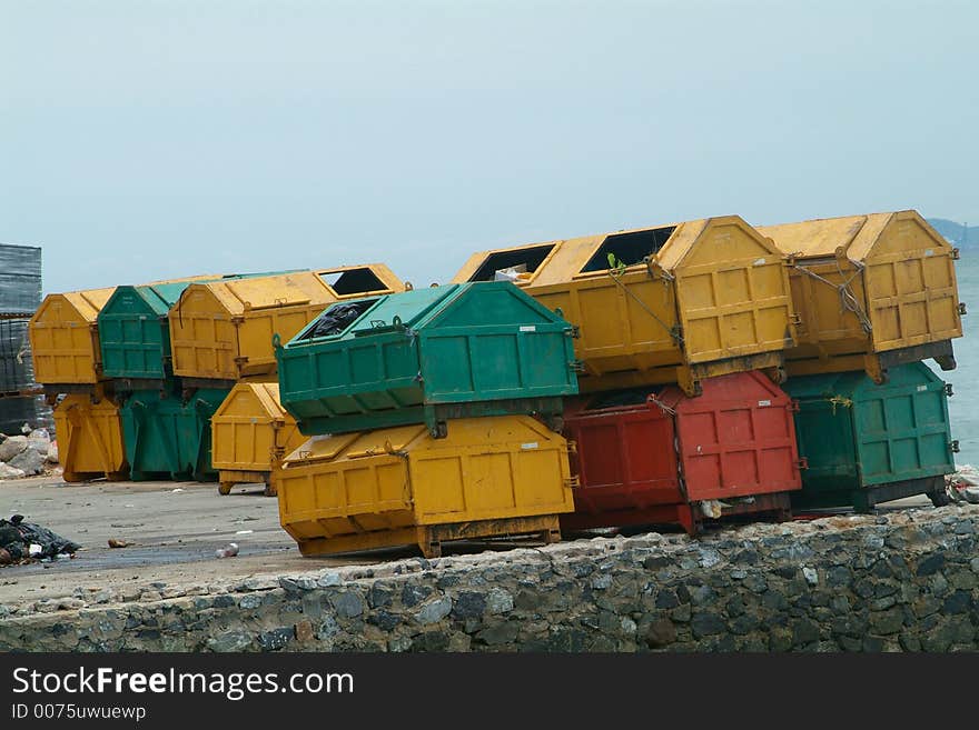 Yellow, green and red garbage containers