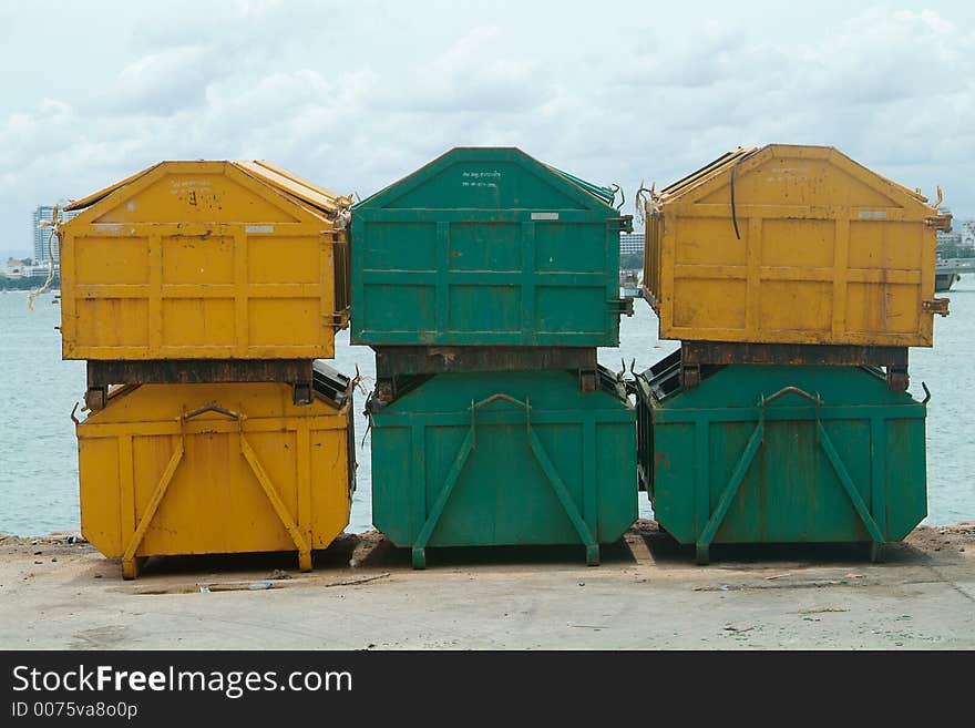 Six garbage containers, yellow and green