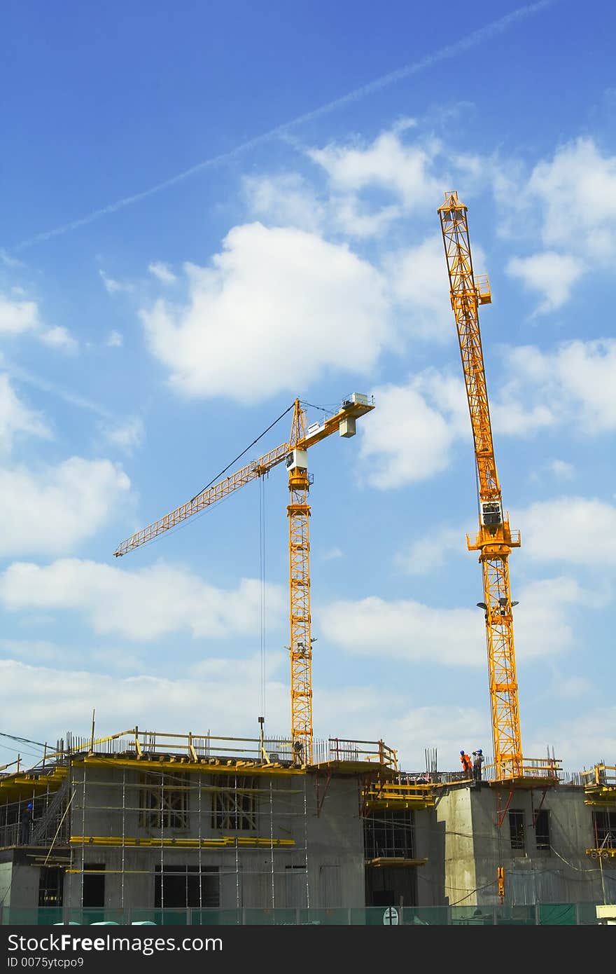 Crane tower on a background of the blue sky