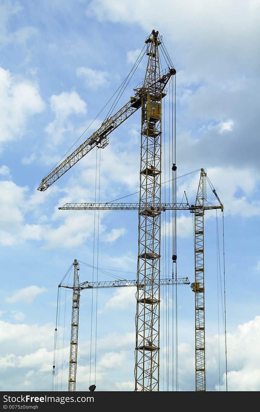 Crane tower on a background of the blue sky