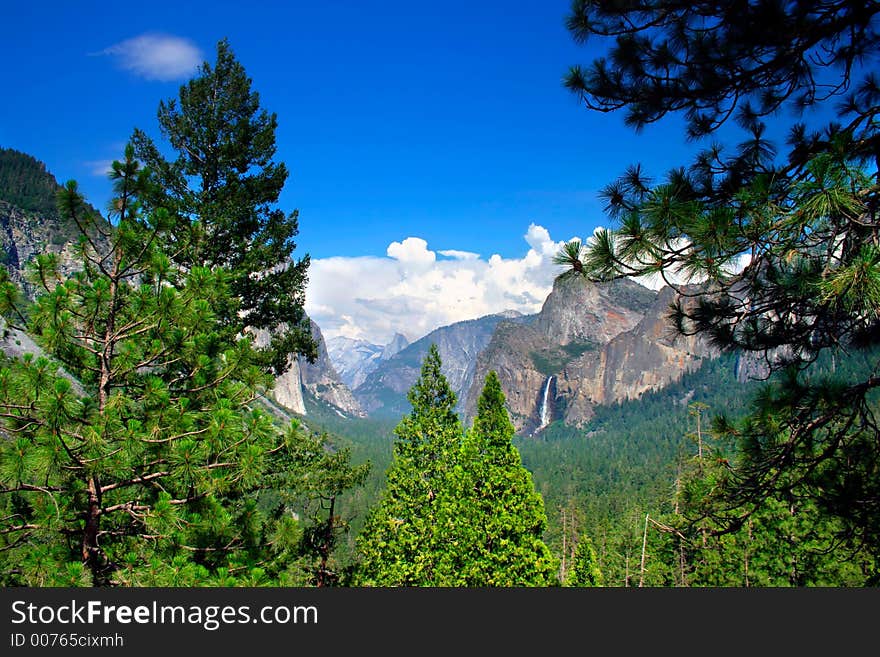 Tunnel View at Yosemite National park offers a beautiful panorama of Yosemite Valley with El Capitan on the left, Bridalveil Fall on the right and Half Dome in the center. Tunnel View at Yosemite National park offers a beautiful panorama of Yosemite Valley with El Capitan on the left, Bridalveil Fall on the right and Half Dome in the center.