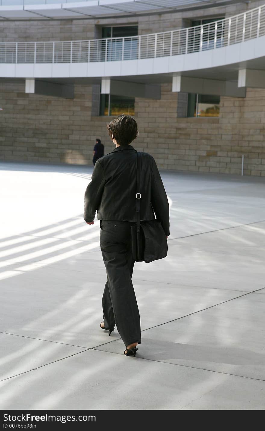 Business woman walking to work