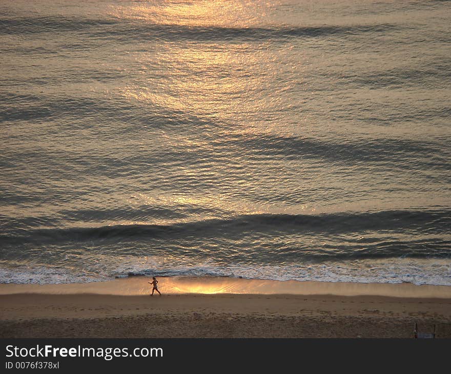 Early morning jog on the beach. Early morning jog on the beach