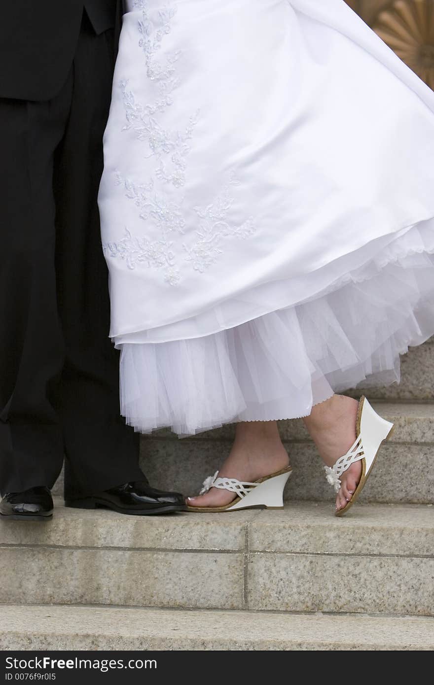 Bride and groom s feet in shoes