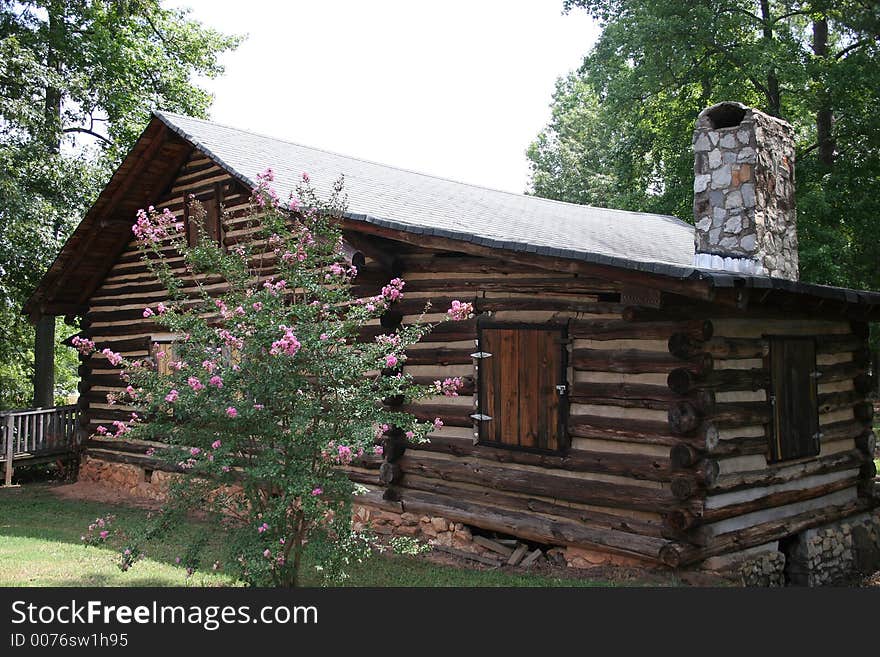 Old rustic log cabin in woods