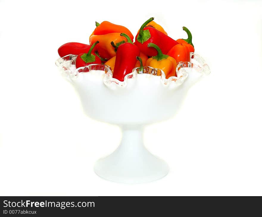 Assorted sweet peppers in a white display dish