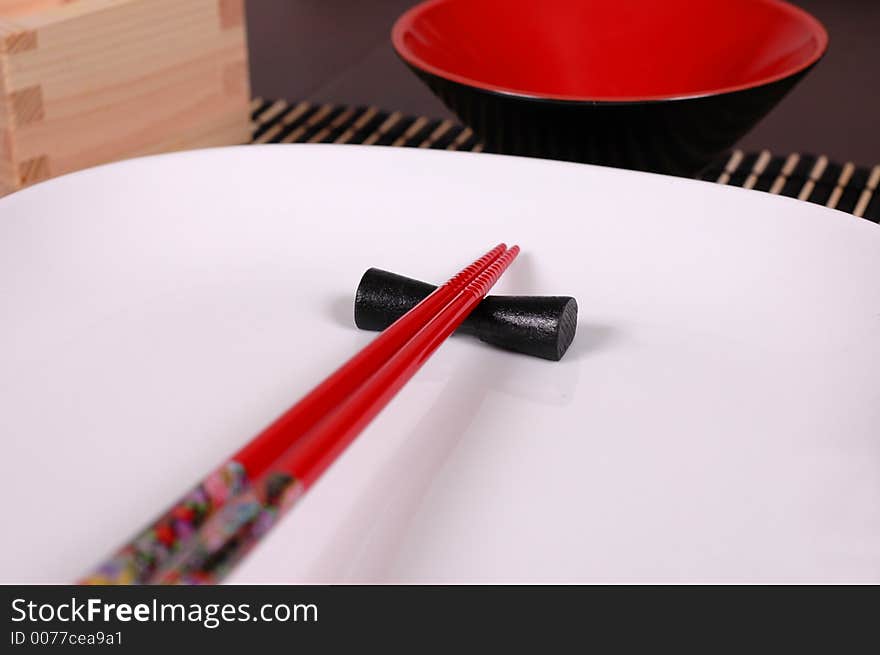 Chopsticks on white plate