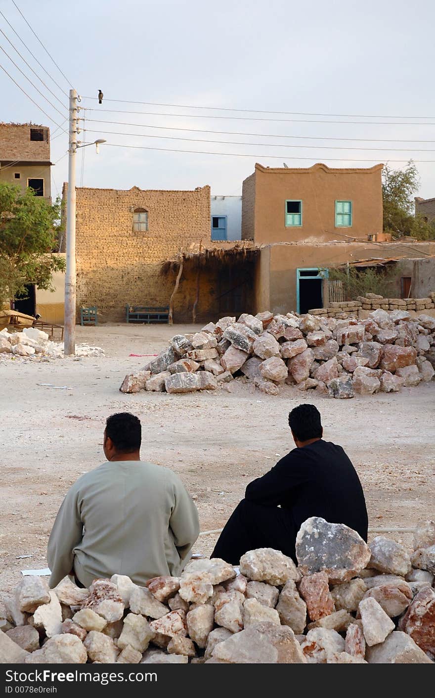 2 men sitting in an Egyptian village. 2 men sitting in an Egyptian village