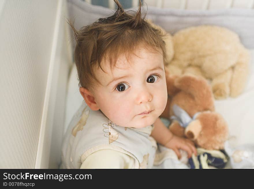 Infant waking up in bed. Infant waking up in bed