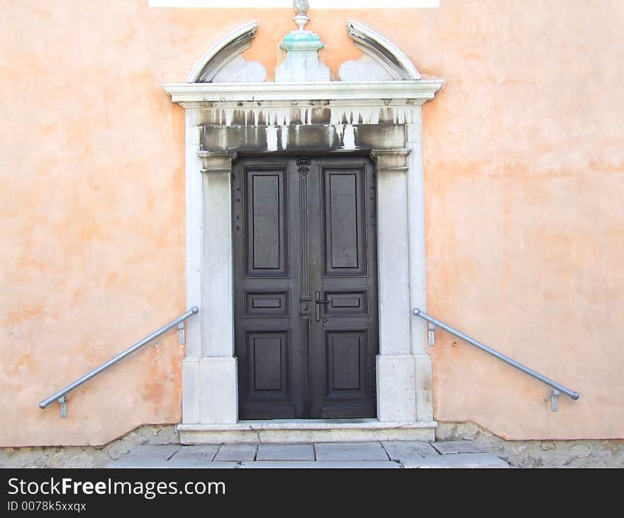 Old church portal with apricot background