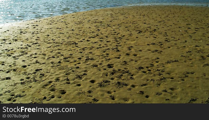 On the beach : sand and water