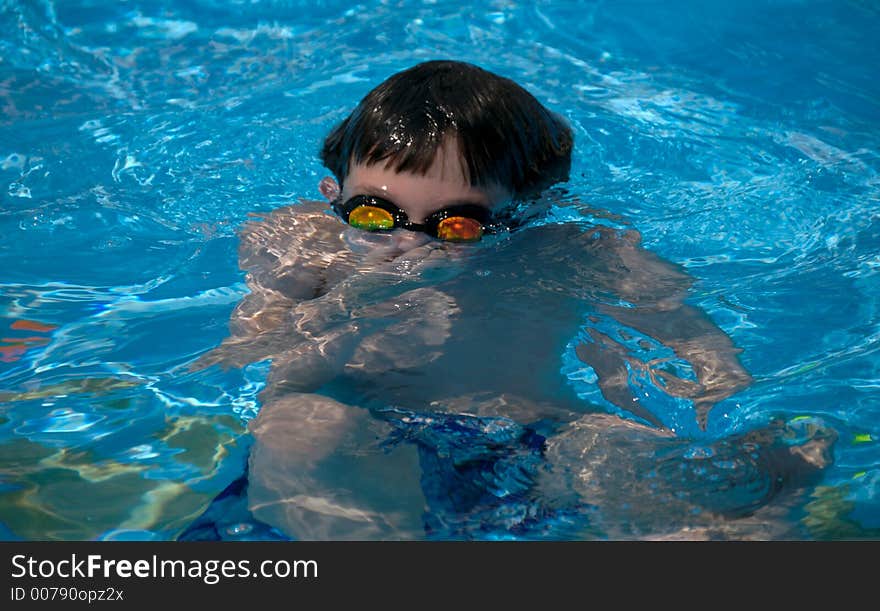 Young boy holding breath underwater. Young boy holding breath underwater