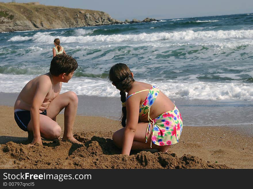 The teenagers on a beach