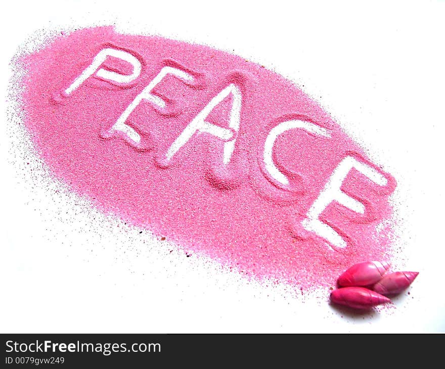 The word peace in pink sand. The word peace in pink sand