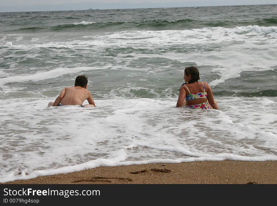 The teenagers on a beach