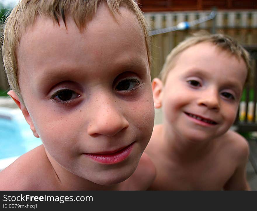 Twin boys at the pool side. Twin boys at the pool side