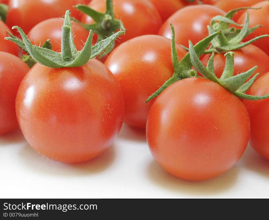 Red Tomatoes on white background. Red Tomatoes on white background.