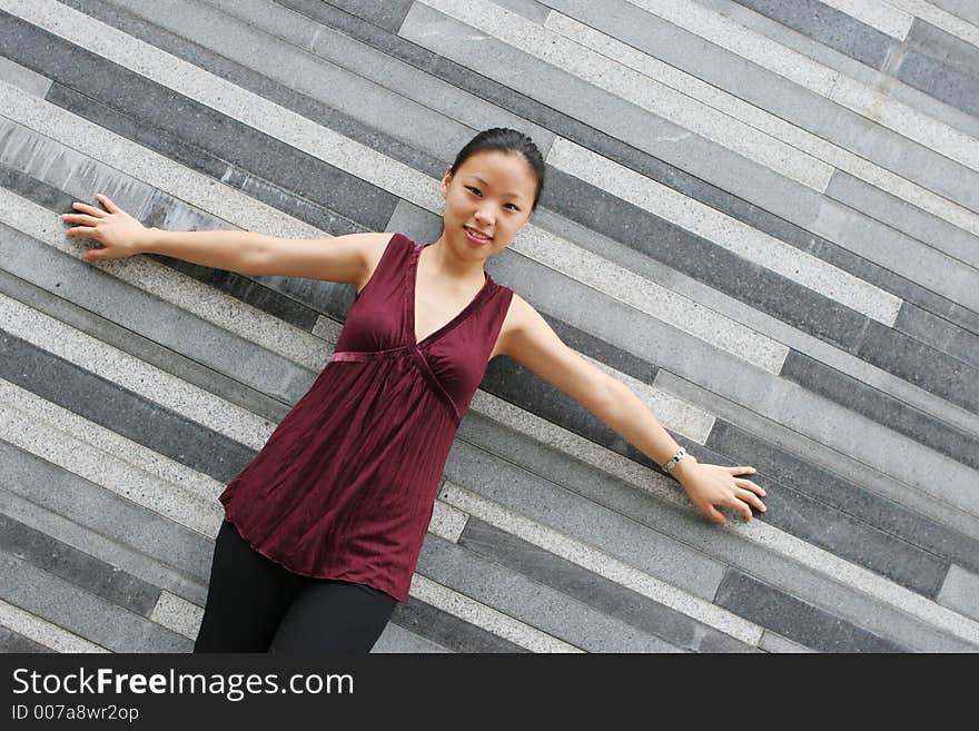 Pretty Korean woman with her arms stretched out. Pretty Korean woman with her arms stretched out