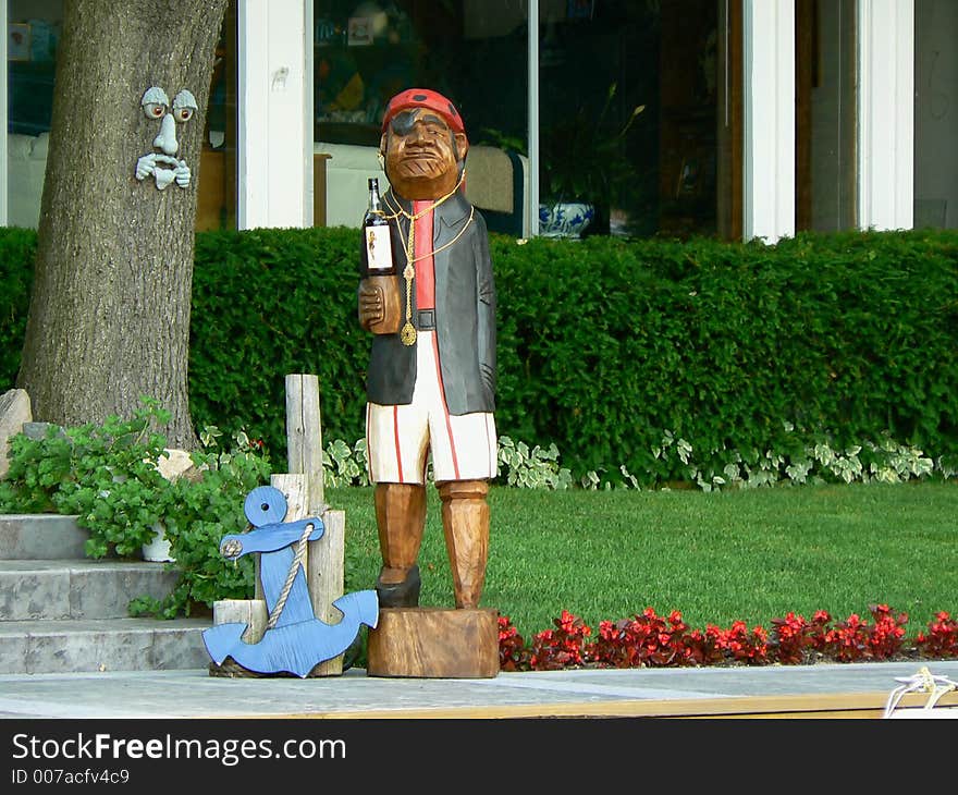 A carved wooden pirate statue that we discovered outside of a lake house while we were out boating.