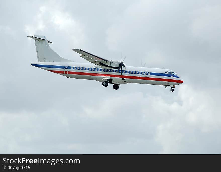 Descending Aerospetiale ATR-72 airplane ready for landing. Descending Aerospetiale ATR-72 airplane ready for landing