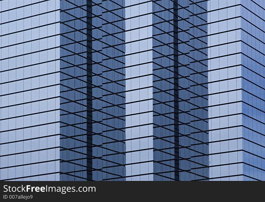 Modern hi-rise corporate office building close-up, wide orientation