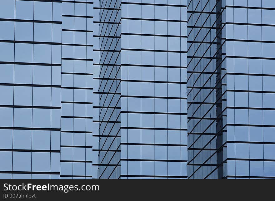 Modern office building with glass exterior, wide orientation