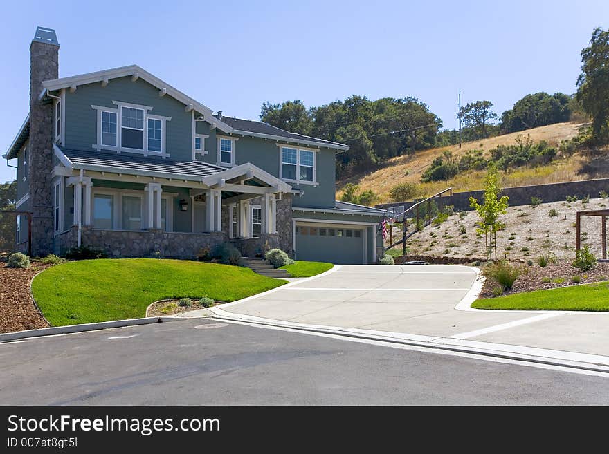 Exterior shot of a large, luxurious home. Exterior shot of a large, luxurious home.