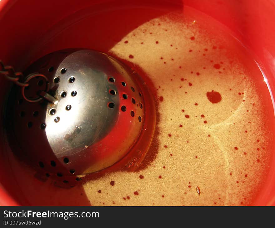 Closeup of a red cup of tea. Closeup of a red cup of tea