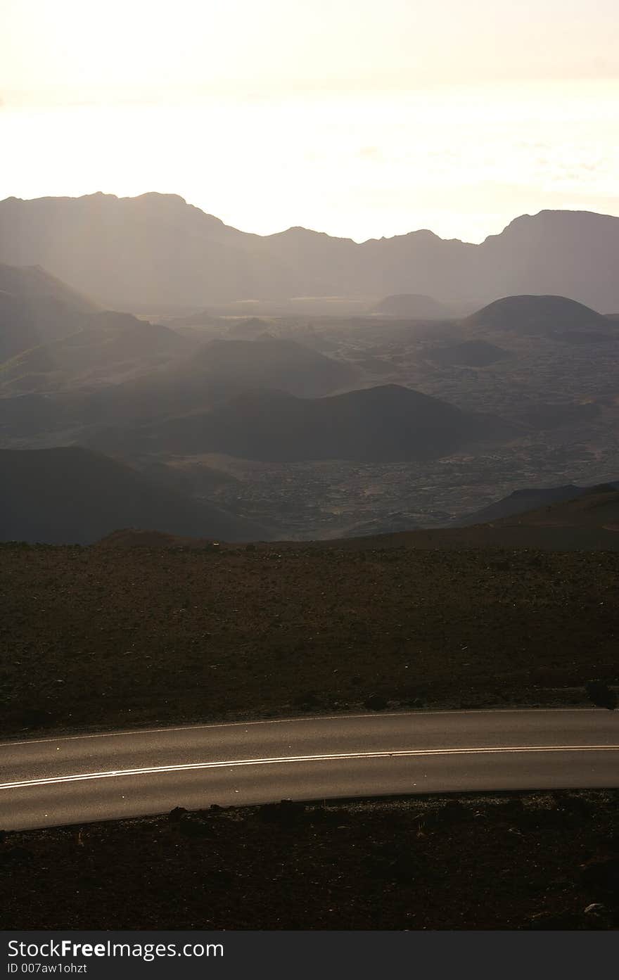 View of empty road and volcanic craters at the summit of Haleakala volcano, Maui, Hawaii. View of empty road and volcanic craters at the summit of Haleakala volcano, Maui, Hawaii