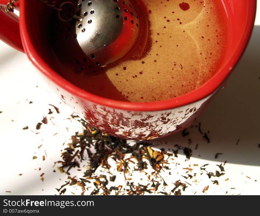 Closeup of a red cup of tea, with shallow DOF. Closeup of a red cup of tea, with shallow DOF