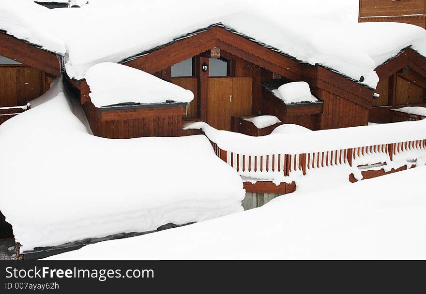 Chalet with snow on the roof Courchevel France