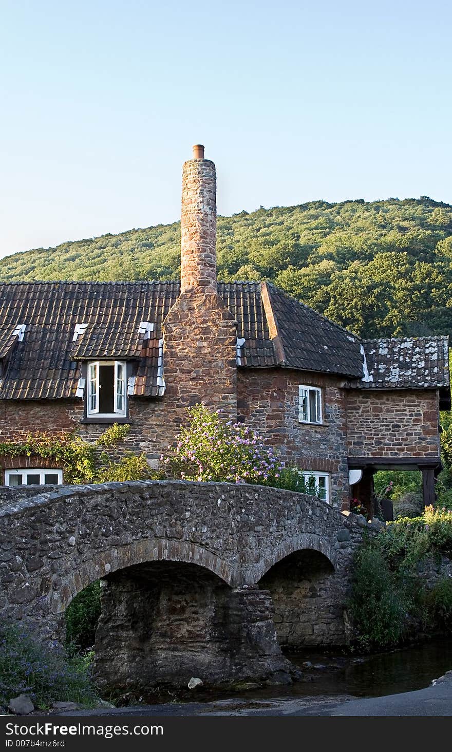 Old bridge leading to an old english cottage