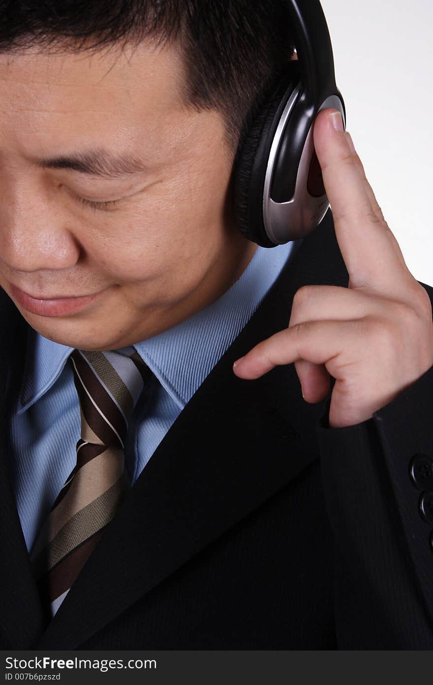 Asian businessman listening