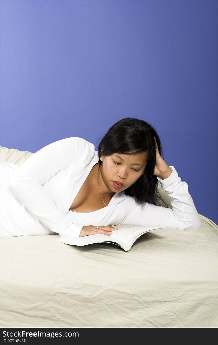 Girl reading book over blue background