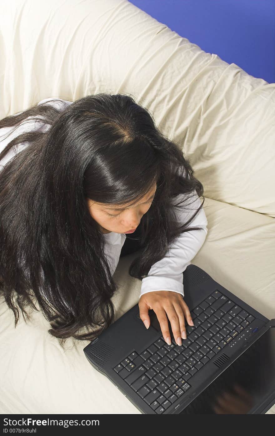 Girl with hand on laptop. Girl with hand on laptop